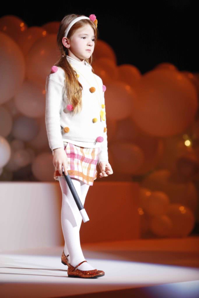 Pom poms and plaids with a magic stick kids fashion in Italy by Il Gufo fall 2017