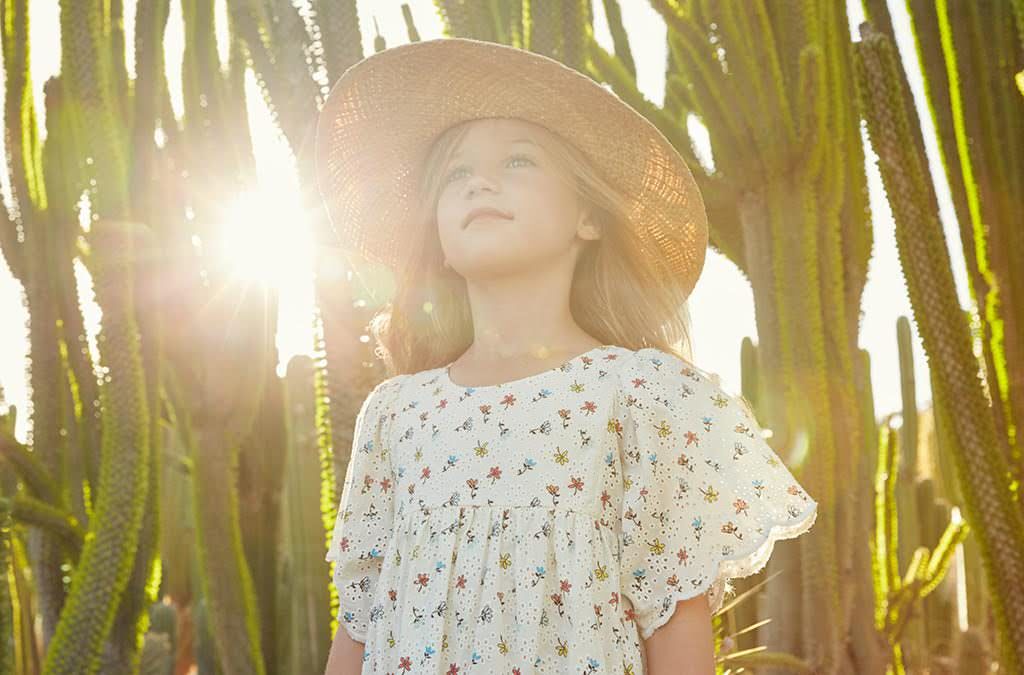 Ivory Broderie Anglaise print dress and sunhat by Chloe at Childrensalon