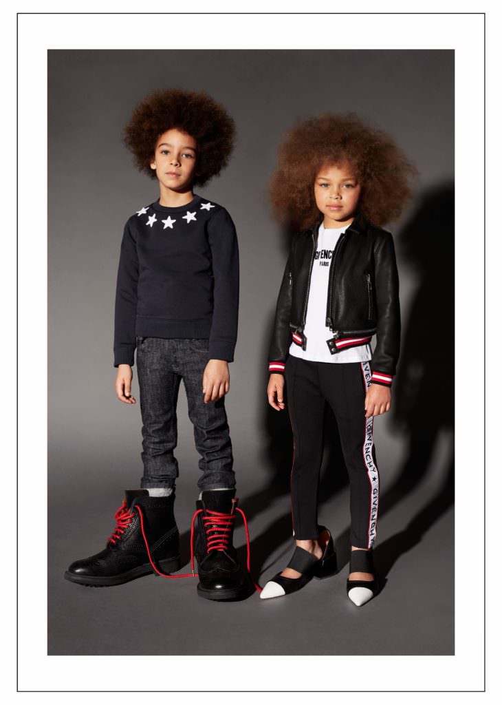 Givenchy Kids showing the star pattern signature and the logo strip track pants for fall 2017