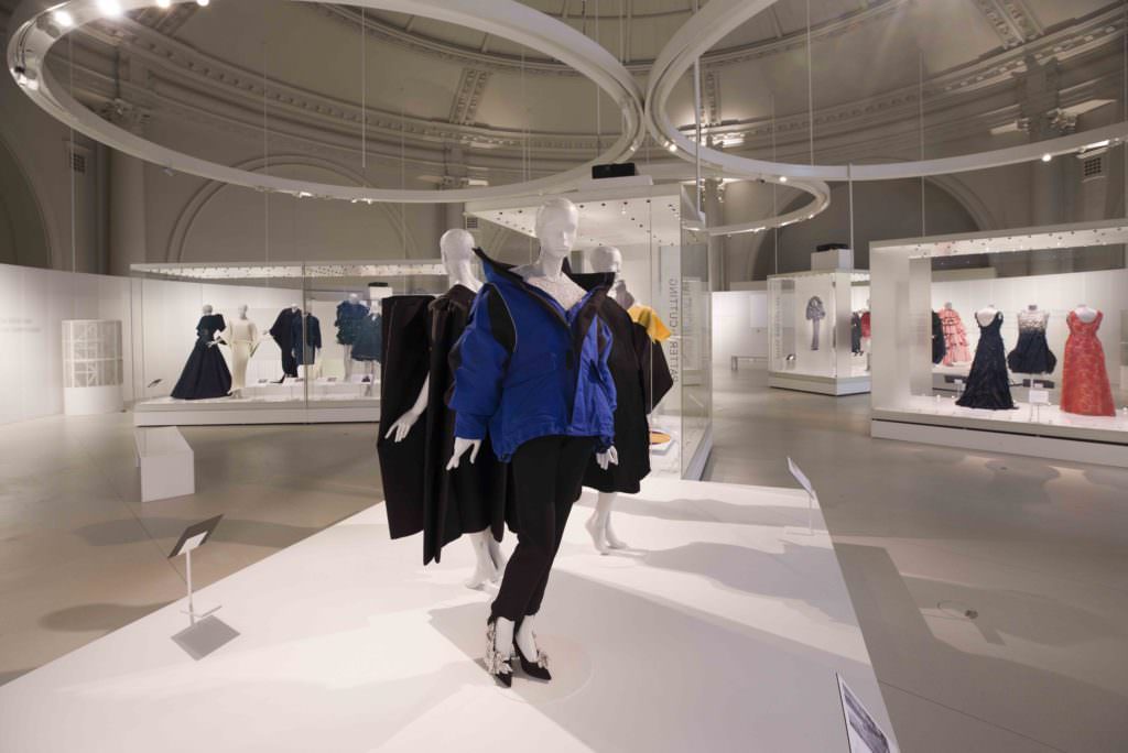 The upstairs gallery with the modern inspirations derived from Balenciaga's philosophy, in front the controversial off shoulder padded coat by Demna Gvasalia 2015