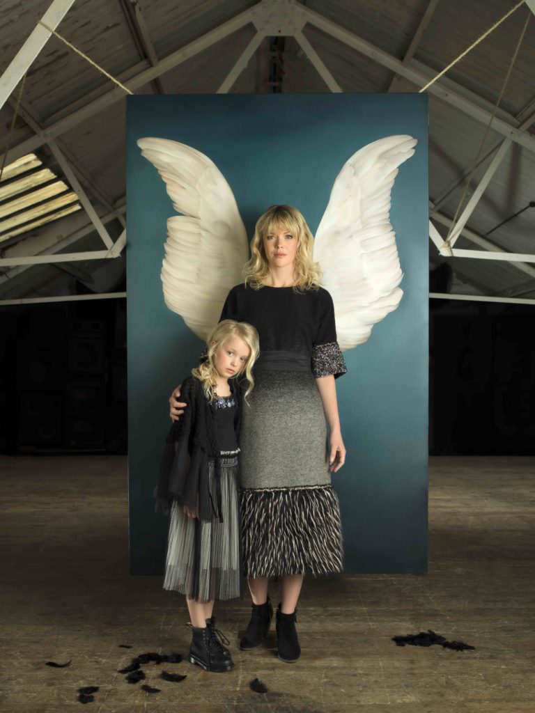 Family style portrait by Julia Boggio; Kirsty-Lee wears Rocky Star. Layla wears Noe and Zoe cape, Tutu Du Monde shirt, DKNY skirt and Dr Martens shoes.