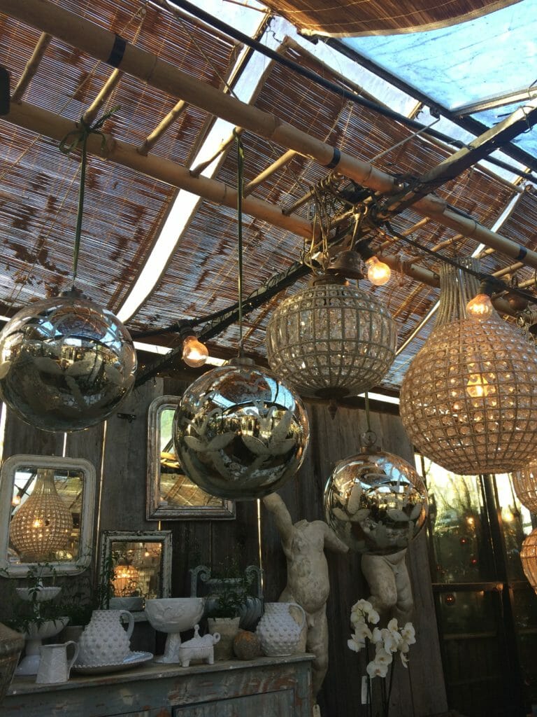 Giant silver bauble Xmas holiday decorations at Petersham Nurseries