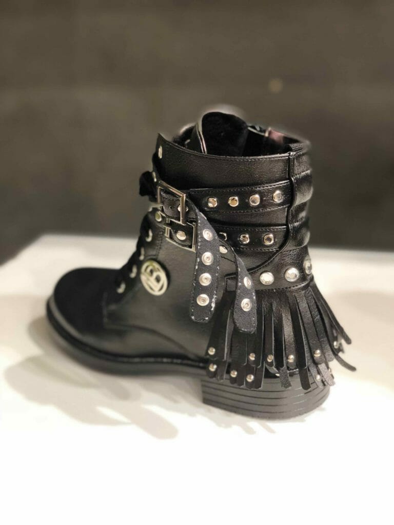 Laura Biagiotti Dolls shows the biker boot with all the kids footwear trends, buckles, fringes, studs for FW18