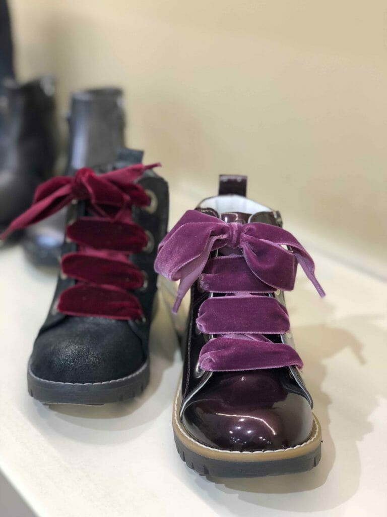 Wide velvet ribbon ties at Primigi kids footwear for fall 2018 at MICAM Milano