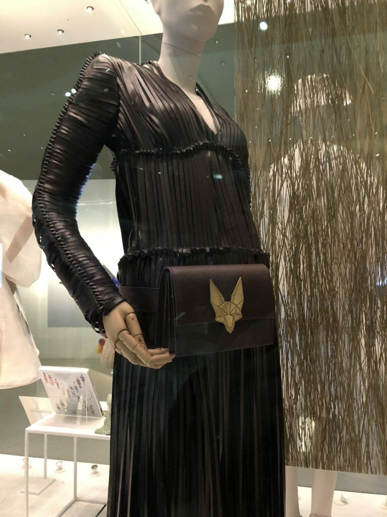 This fringed dress and bag is made from Vegea, an alternative leather made from stalks, seeds and grapes eft over from wine production which was launched as a fashion collection in October 2017 designed by Tiziano Guardini