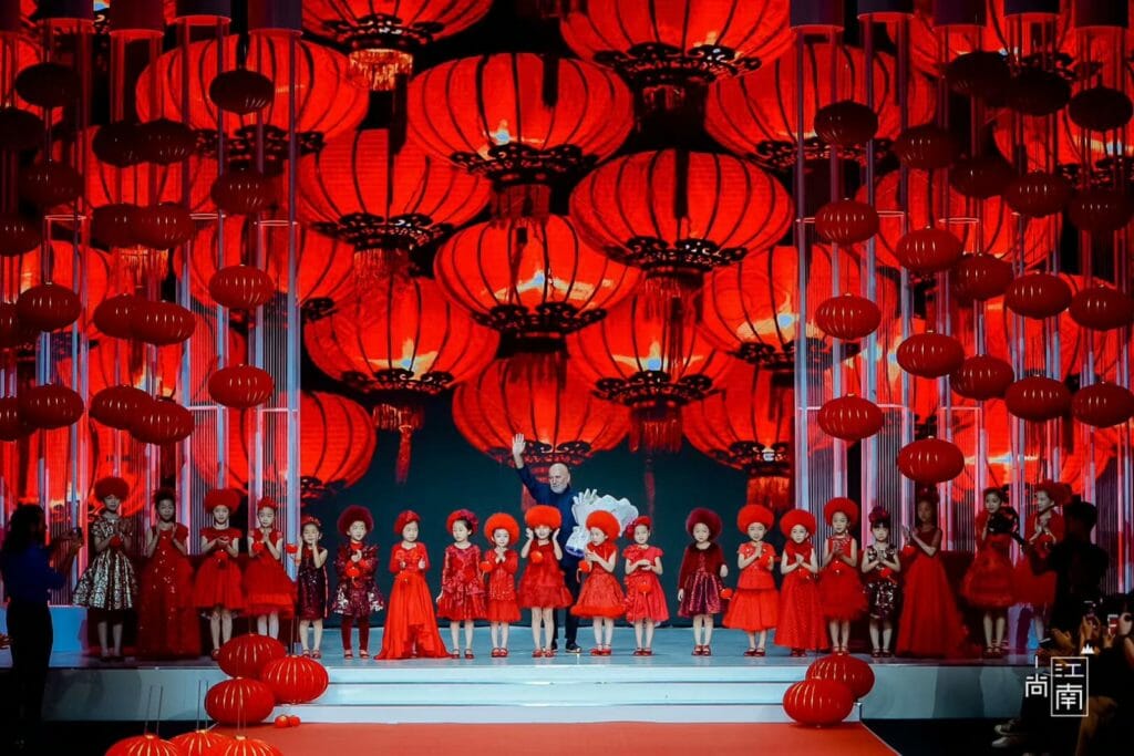 20 models in red at Shanghai fashion week for kids fashion from Italy