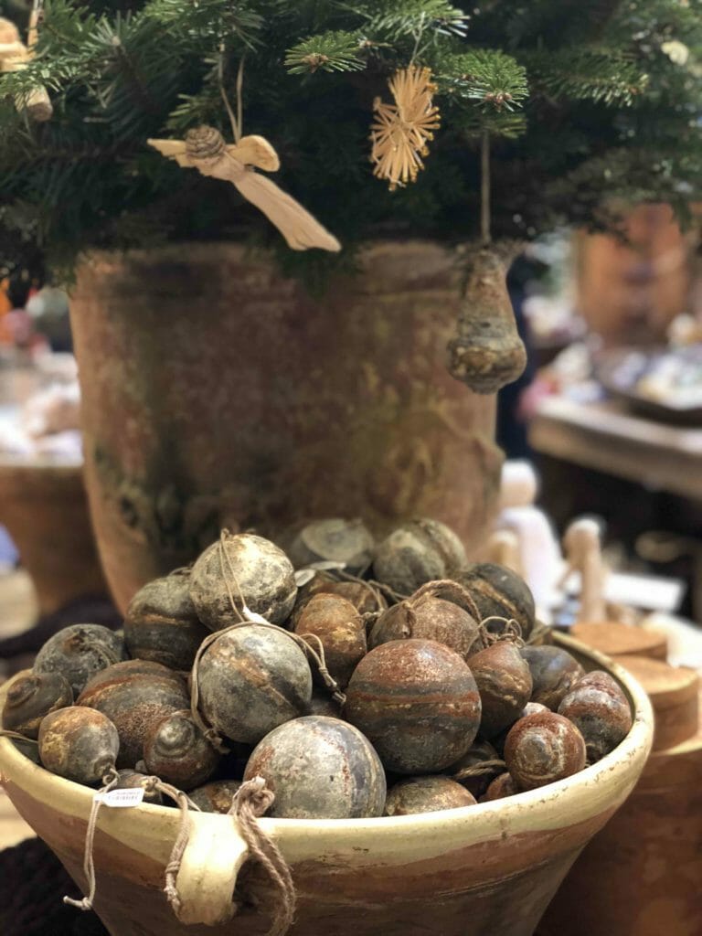 Natural rust effect baubles at Petersham Nurseries in Covent Garden