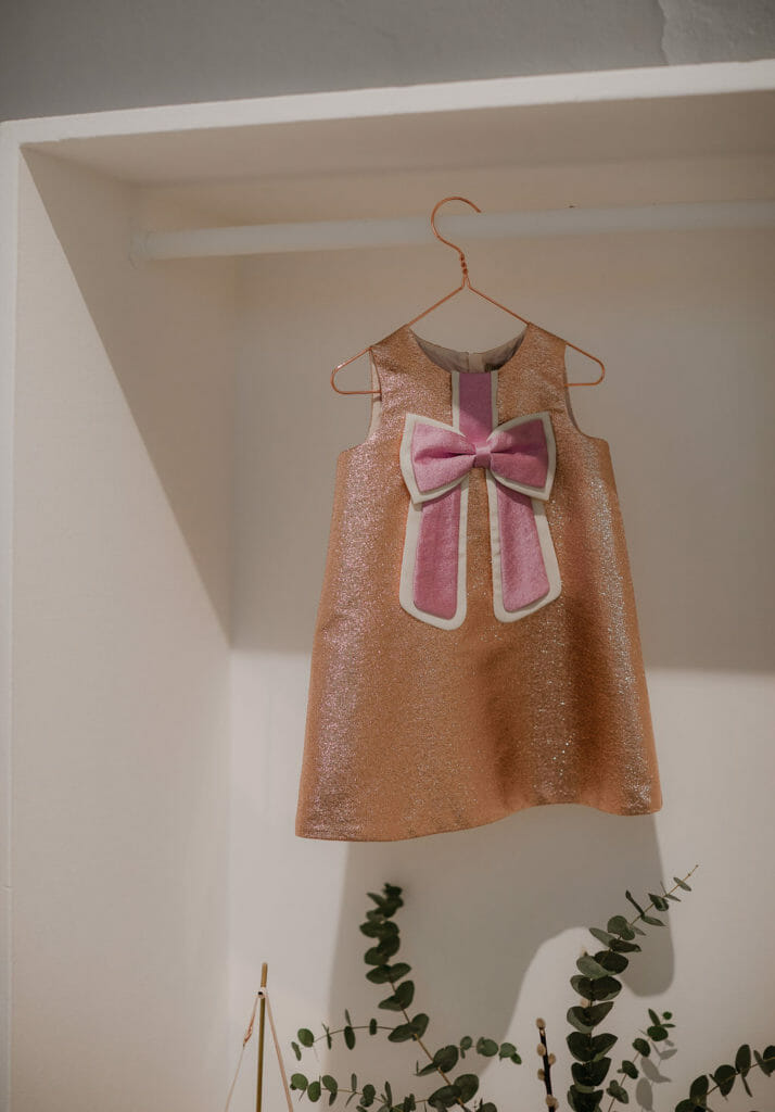 Sweet sequin bow party dress by British label Hucklebones at Pitti Bimbo 88, photo Abi Campbell