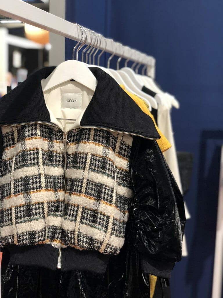 Textured tweed mixed with a newly developed shiny lightweight black fabric at Once for FW19 kids fashion 