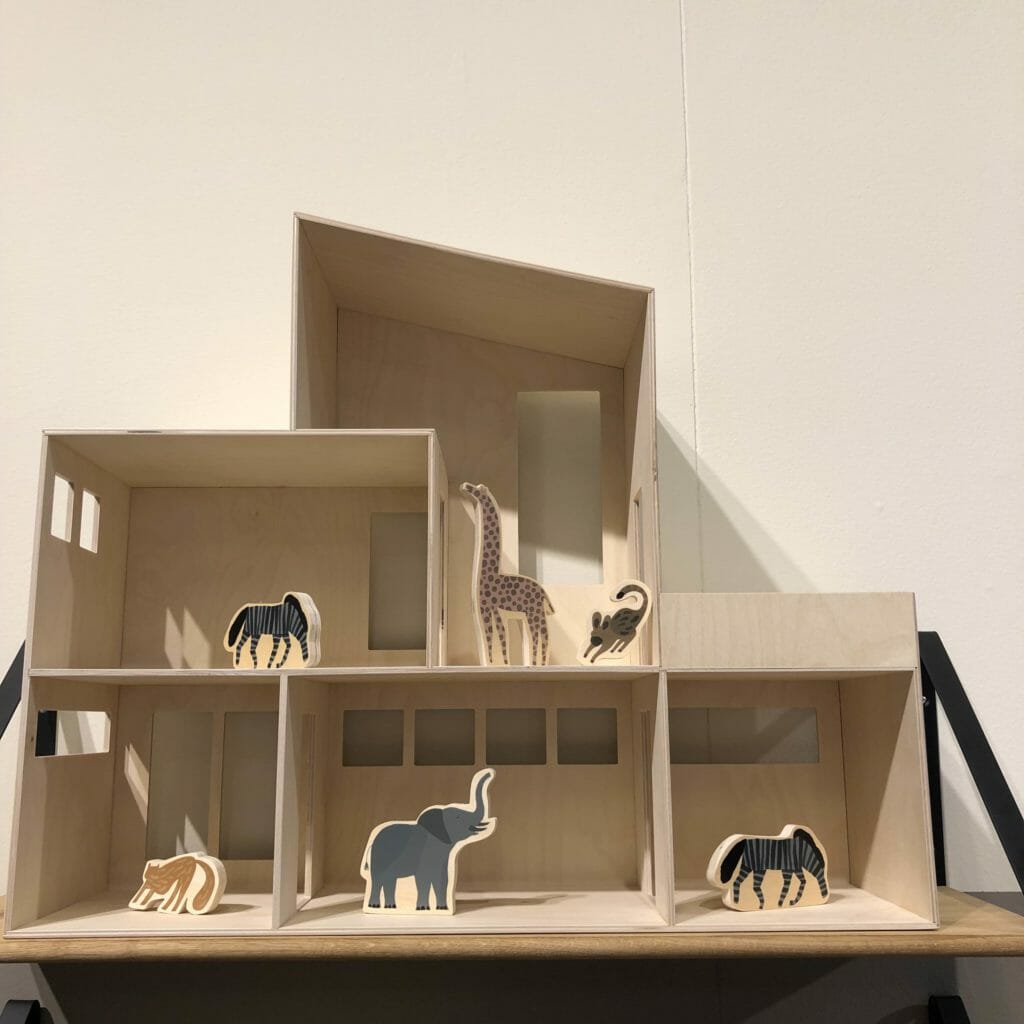 Dolls house by Ferm Living with cut out wooden animals from an early years play set