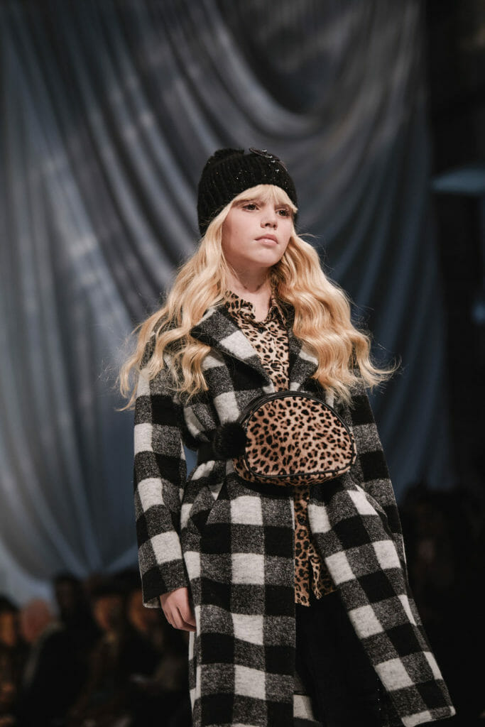 British model Sadie in the Monnalisa show in Florence with plaid checks and leopard accessories