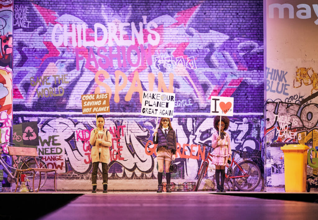 Protest banners at the Childrens fashion from Spain show for Mayoral FW2020
