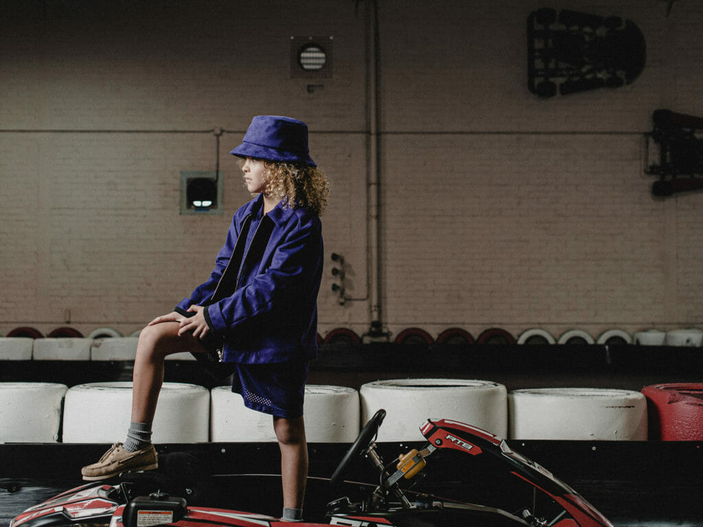 Tonal boys fashion at Boysmans with a deep purple jacket and hat set