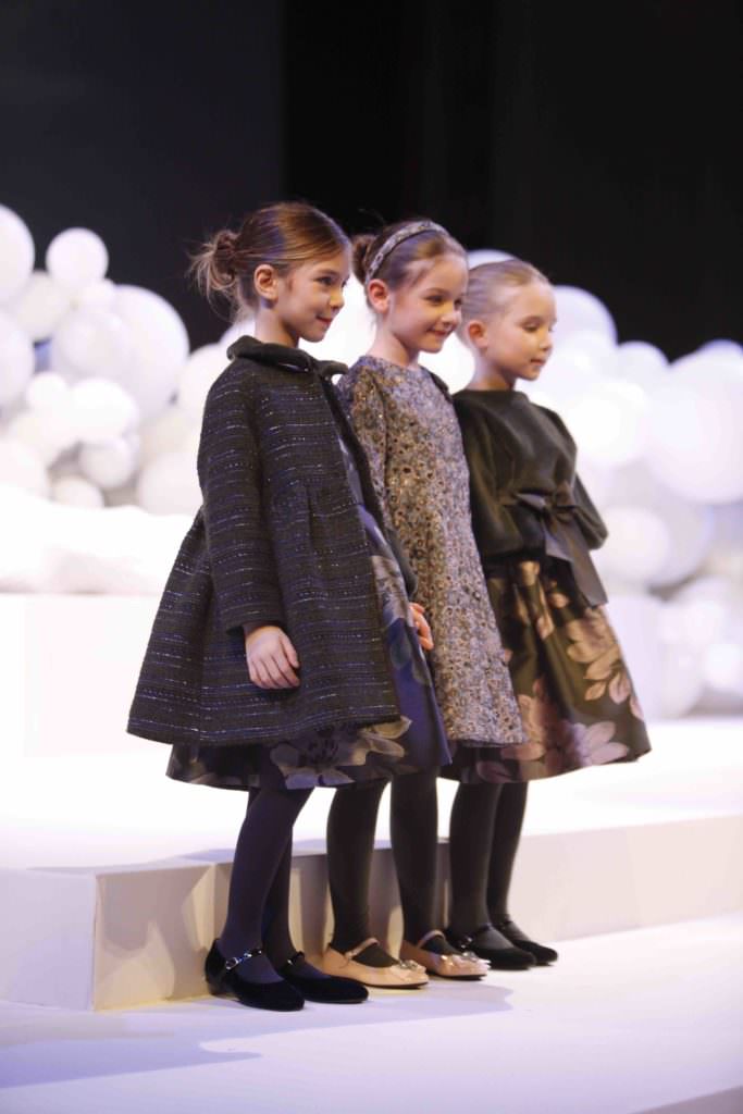Coats had a fit and flare silhouette at Il Gufo kidswear for fall/winter 2017