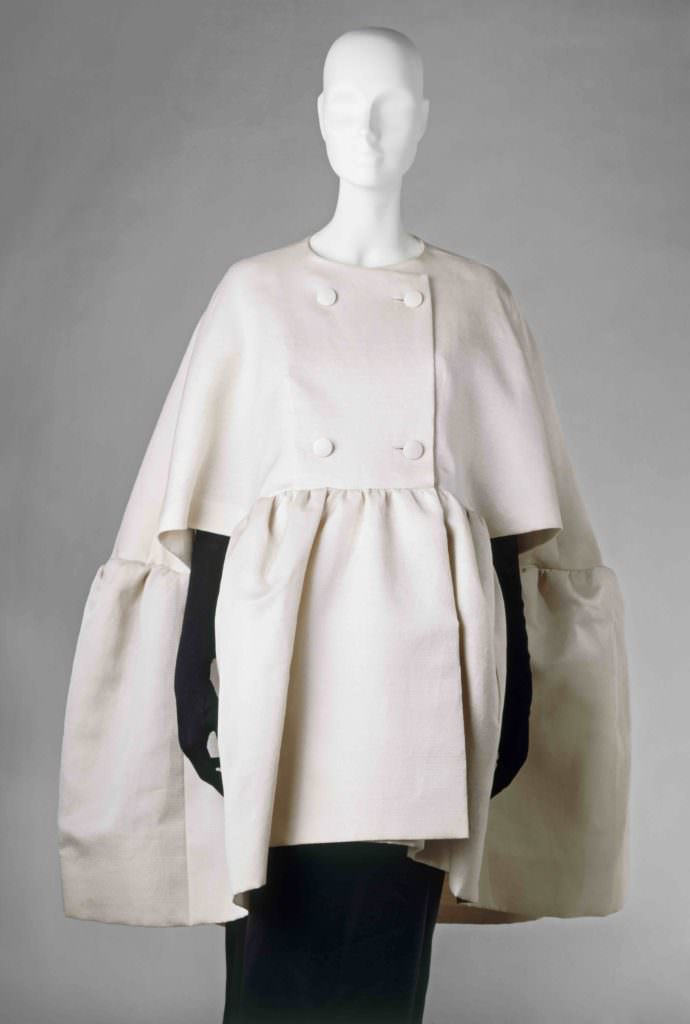 Woman`s double breasted evening cape; white gazar; front view; designed by Cristabel Balenciaga (1895 - 1972) February 1963.