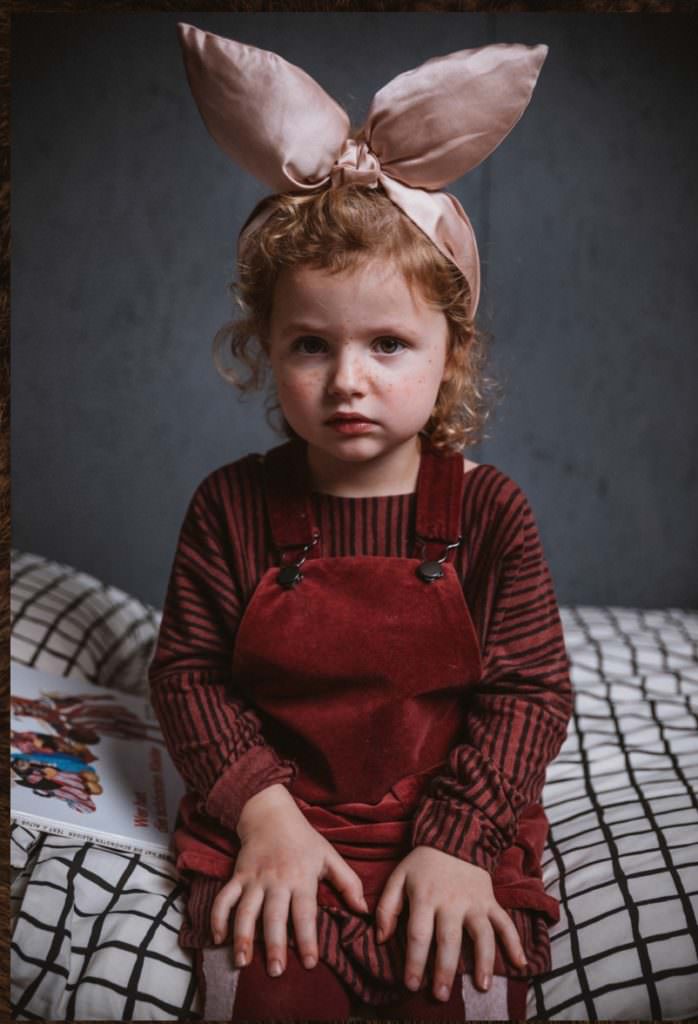 Gorgeous satin bow with rich velvet dungarees at Noe & Zoe for fall 2017