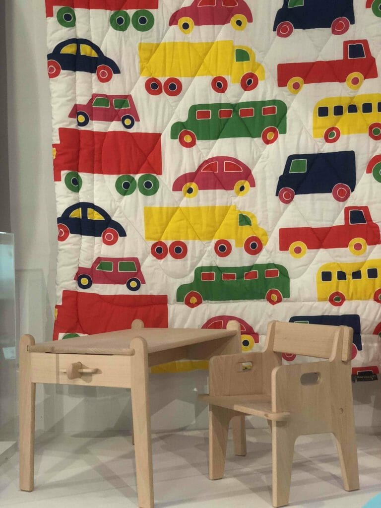 The innovative Peter's chair made by Hans J Wegner in 1944, designed to be sent as a present through the post and assembled without any tools. Backdrop car print duvet cover by Marimekko