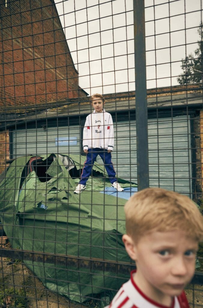 Kyd wears Tennis tracksuit by Lacoste, Bambi football shirt by Caroline Bosmans, all at Alex and Alexa, Trainers Reebok . Joey wears vintage football shirt 