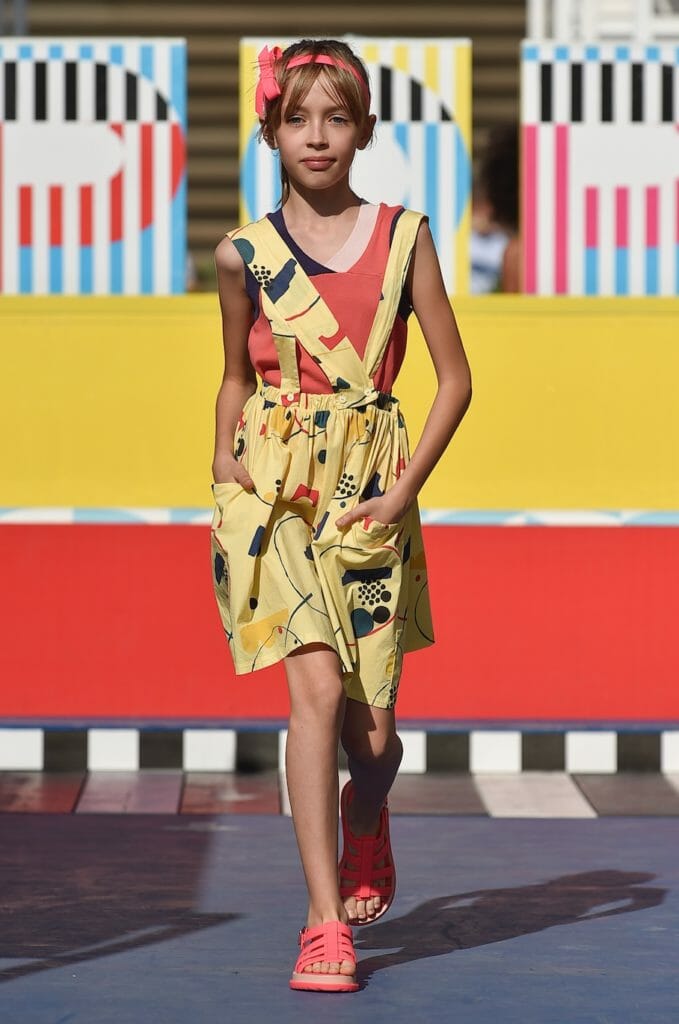 Bib dresses and dungaree variations are very popular for kids fashion trends SS19, here from Barn of Monkeys at Pitti Bimbo 87